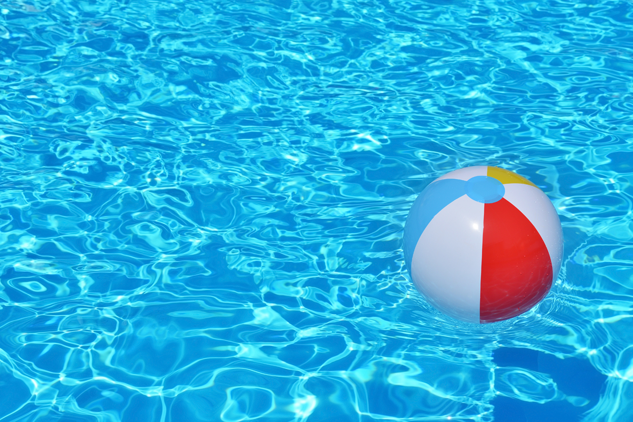 Colorful-inflatable-ball-floating-in-swimming-pool-