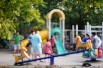 Colorful-playground-with-children-and-parents-in-park